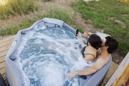 Relaxing Couple Enjoying a Hot Tub Outdoors at Hill Country Soulcation